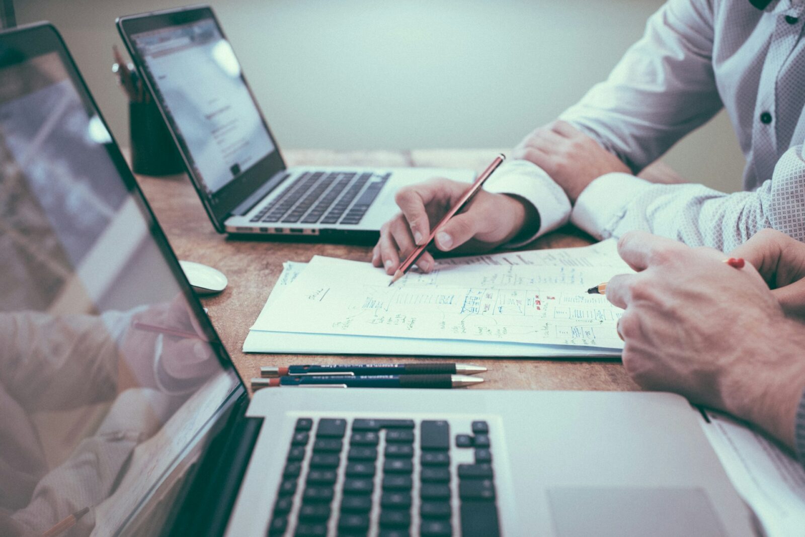 An employee and employer sitting at a desk, discussing employment law and workplace rights in a professional setting