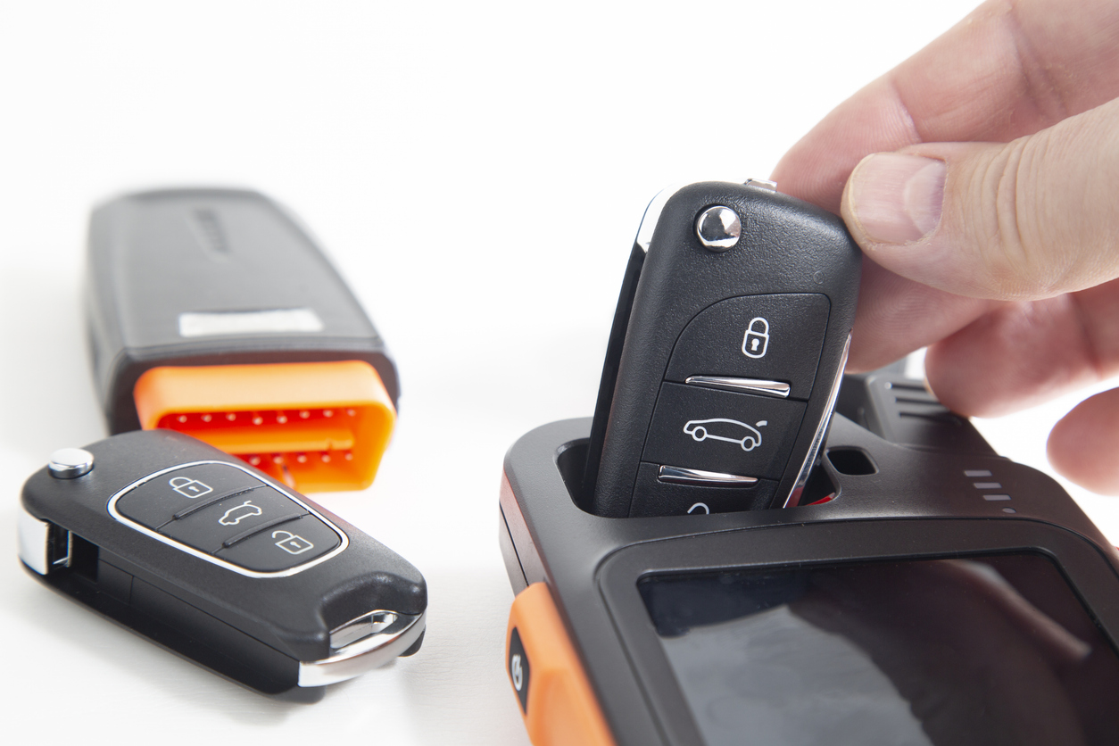 professional locksmith using specialized tools to work on a door lock, showcasing precision and skill in handling lock mechanisms without resorting to lock picking methods