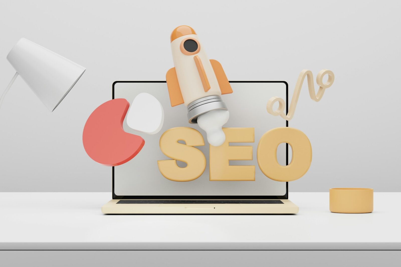 3D illustration of the letters 'SEO' with a rocket launching above a laptop screen, symbolizing growth in search engine optimization, surrounded by a desk setup with a lamp and other minimalistic objects